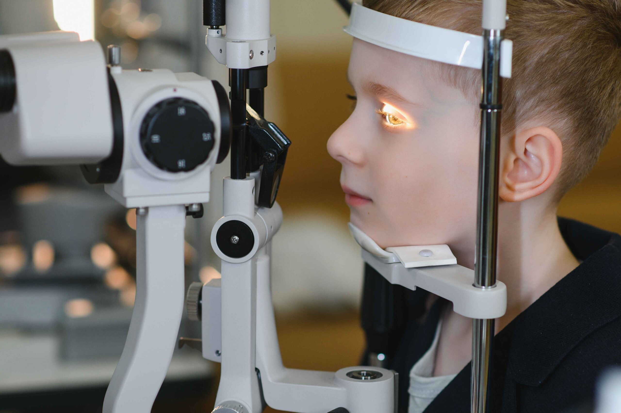 Contact lens being carefully placed onto a person’s eye during a fitting appointment