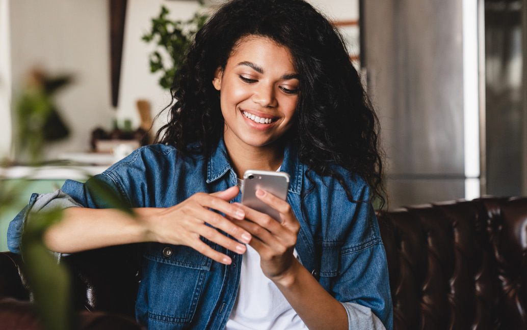 Woman reading frequently asked questions on her mobile phone